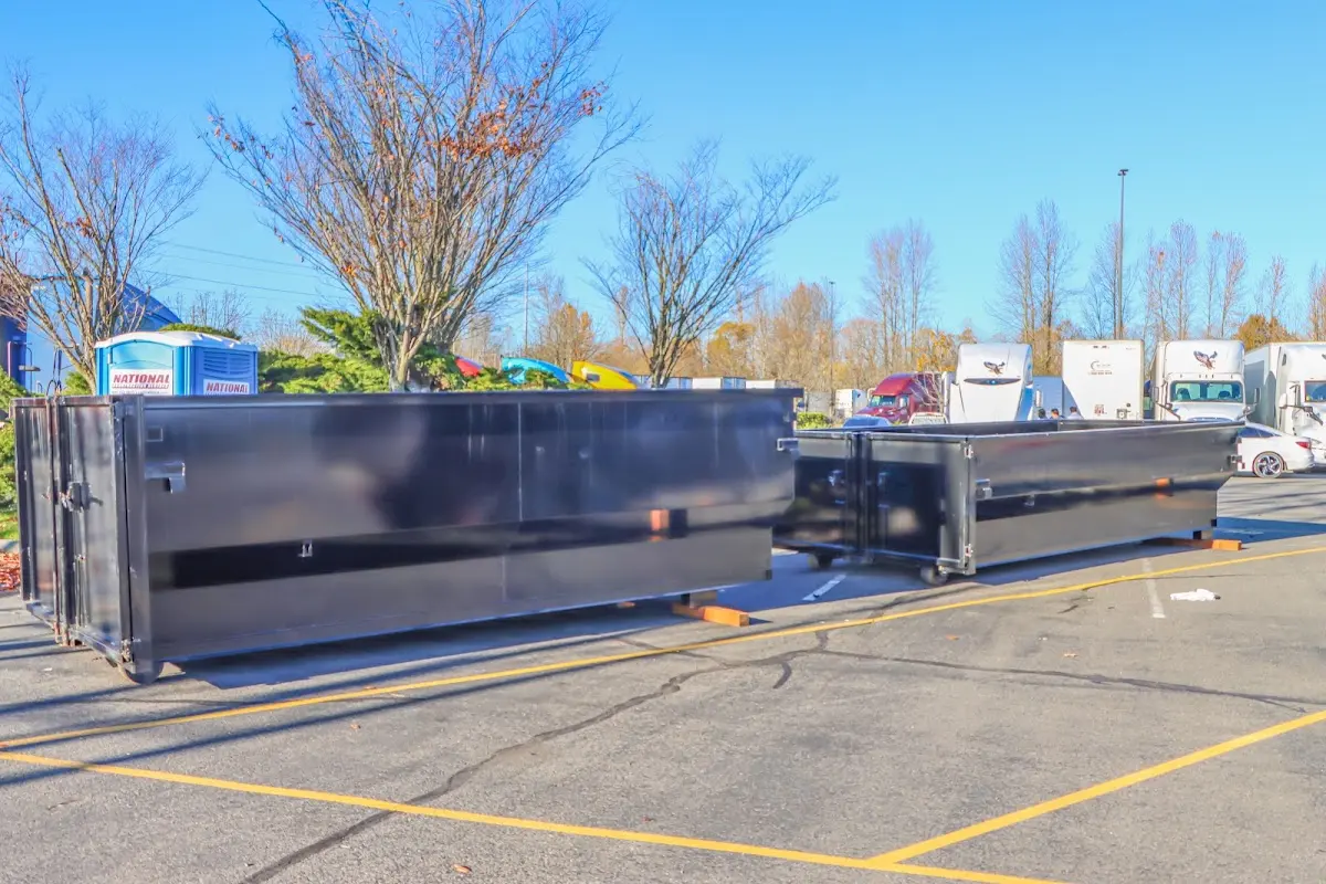 Professional dumpster rental service with roll-off container on residential driveway in Crestwood